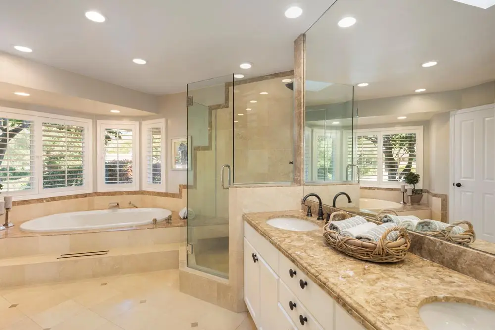 Luxurious custom built bathroom with walk-in shower and tub