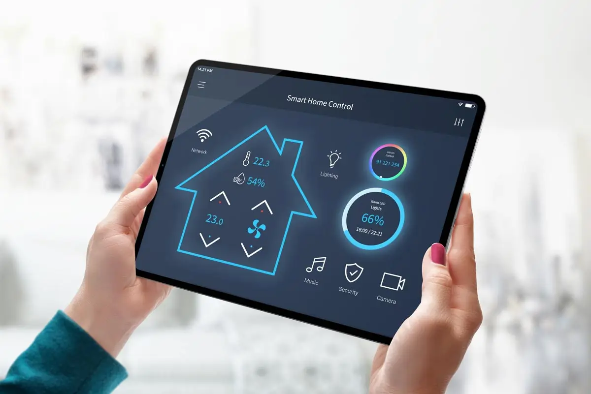 Woman interacting with tablet featuring home automation app for Smart Home Technology.